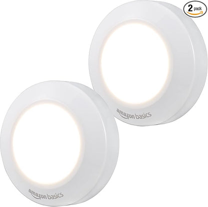 Amazon Basics LED Puck Lights, Battery Operated, 50 Lumens, Under Cabinet Lighting, Easy to Install, Easy to Use, Adhesive Backing, 2-Pack, White
