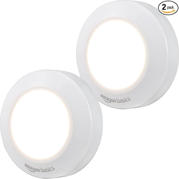 Amazon Basics LED Puck Lights, Battery Operated, 50 Lumens, Under Cabinet Lighting, Easy to Install, Easy to Use, Adhesive Backing, 2-Pack, White